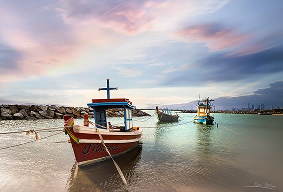 Thai Fishing boats in Thailand, sunset, Photo by Russ Thorne