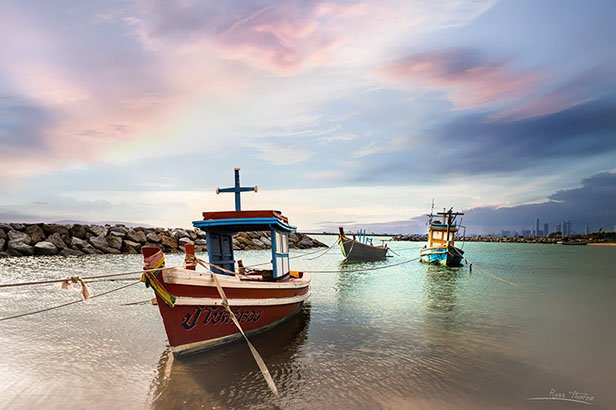 Thai Fishing boats in Thailand, sunset, Photo by Russ Thorne