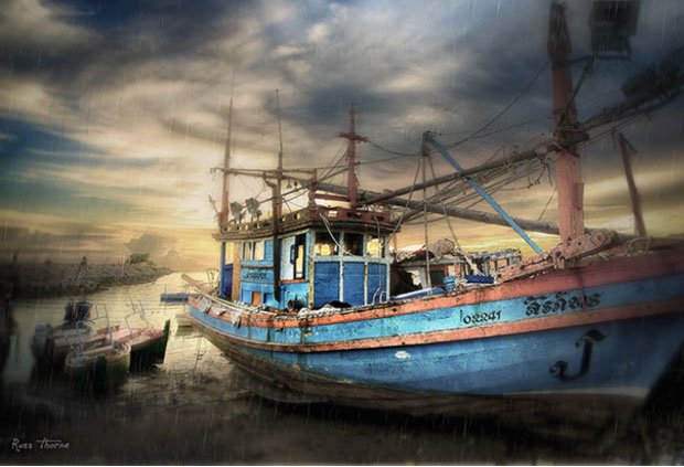 Thai Fishing boats in Thailand, sunset, Photo by Russ Thorne