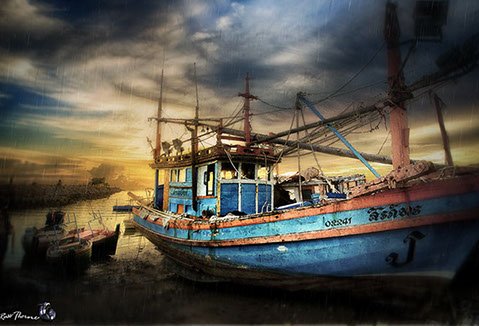 Thai Fishing boats in Thailand, sunset, Photo by Russ Thorne