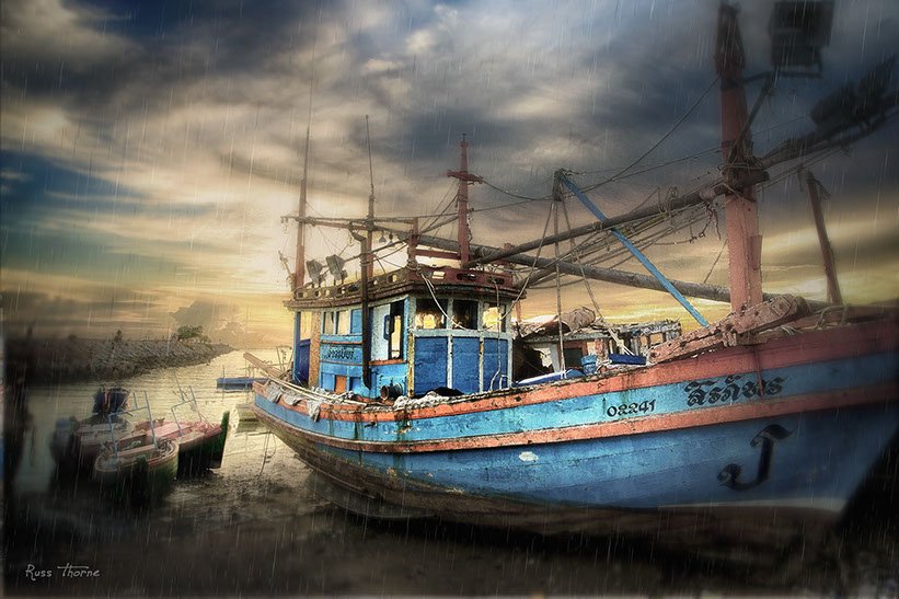 Thai Fishing boats in Thailand, sunset, Photo by Russ Thorne