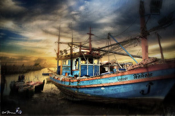 Thai Fishing boats in Thailand, sunset, Photo by Russ Thorne