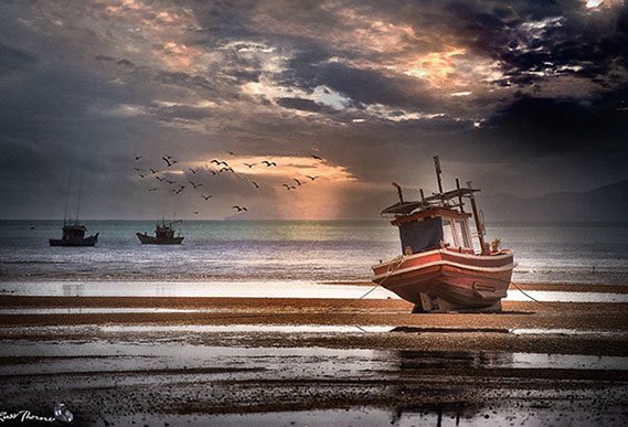 Thai Fishing boats in Thailand, sunset, Photo by Russ Thorne