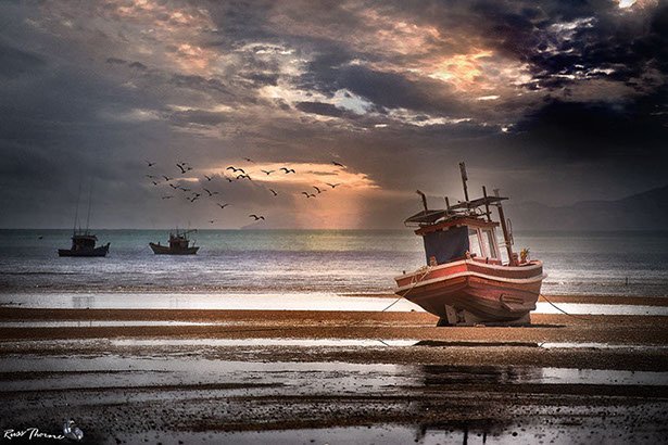 Thai Fishing boats in Thailand, sunset, Photo by Russ Thorne