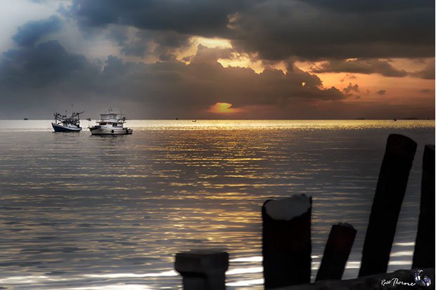 Thai Fishing boats in Thailand, sunset, Photo by Russ Thorne
