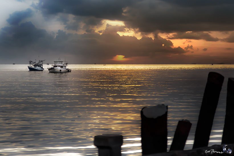 Thai Fishing boats in Thailand, sunset, Photo by Russ Thorne