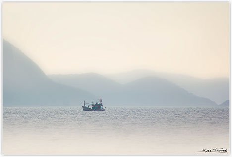 Thai Fishing boats in Thailand, sunset, Photo by Russ Thorne