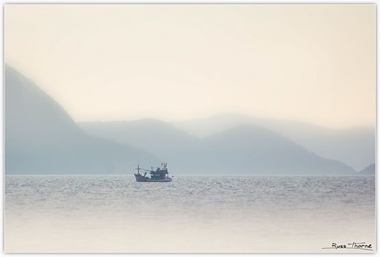 Thai Fishing boats in Thailand, sunset, Photo by Russ Thorne